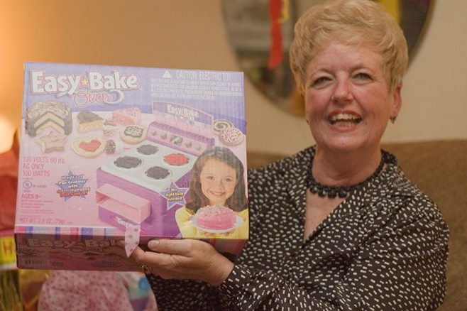 Grandma holding easy bake oven. Grandma holding easy bake oven.